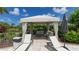 Private cabana with lounge chairs at 12413 Osorio Ct # 103, Sarasota, FL 34238