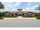 Exterior of a Mediterranean-style community clubhouse at 12413 Osorio Ct # 103, Sarasota, FL 34238