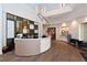 Elegant lobby with a curved reception desk and comfortable seating at 12413 Osorio Ct # 103, Sarasota, FL 34238