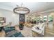 Relaxing community room with comfortable seating and large screen TV at 12413 Osorio Ct # 103, Sarasota, FL 34238