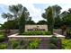 Stone sign marking the entrance to the Esplanade community at 12413 Osorio Ct # 103, Sarasota, FL 34238