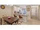 Spacious dining area with kitchen and entryway view at 12413 Osorio Ct # 103, Sarasota, FL 34238