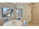 Bright dining area with a round table and four chairs at 12413 Osorio Ct # 103, Sarasota, FL 34238