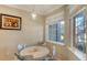 Small dining area with a round table and four chairs at 12413 Osorio Ct # 103, Sarasota, FL 34238