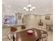 Elegant dining area with a large table and chandelier at 12413 Osorio Ct # 103, Sarasota, FL 34238
