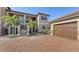 Two-story condo with attached garage and paved parking at 12413 Osorio Ct # 103, Sarasota, FL 34238