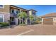 Tan building with two stories, parking and palm trees at 12413 Osorio Ct # 103, Sarasota, FL 34238