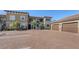 Two-story condo building with parking and tropical landscaping at 12413 Osorio Ct # 103, Sarasota, FL 34238