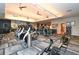 Modern fitness center with cardio and strength training equipment at 12413 Osorio Ct # 103, Sarasota, FL 34238
