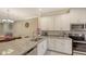 Spacious kitchen with granite countertops and stainless steel appliances at 12413 Osorio Ct # 103, Sarasota, FL 34238
