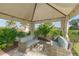 Covered patio with wicker furniture at 12413 Osorio Ct # 103, Sarasota, FL 34238