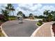 Community playground with climbing structures, slides, and a gazebo at 12413 Osorio Ct # 103, Sarasota, FL 34238