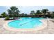Relaxing freeform pool with lap lanes and patio at 12413 Osorio Ct # 103, Sarasota, FL 34238