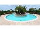 Circular pool with a shallow area and steps at 12413 Osorio Ct # 103, Sarasota, FL 34238