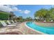 Relaxing resort-style pool with a spa and lounge chairs at 12413 Osorio Ct # 103, Sarasota, FL 34238