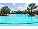 Large resort-style pool with plenty of lounge chairs at 12413 Osorio Ct # 103, Sarasota, FL 34238