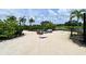 Relaxing sandy area with fire pit and games at 12413 Osorio Ct # 103, Sarasota, FL 34238