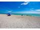Scenic beach view featuring brilliant blue sky, white sand, and crystal clear water at 12651 Garibaldi Ln, Venice, FL 34293