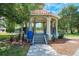 A beautiful outdoor gazebo with steps and wrought iron railings, perfect for relaxing in the community at 12651 Garibaldi Ln, Venice, FL 34293