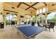 Outdoor patio with ping pong table and seating at 12651 Garibaldi Ln, Venice, FL 34293