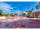 Inviting splash pad with water features, seating, and shaded picnic area at 12651 Garibaldi Ln, Venice, FL 34293