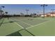 Well-maintained community tennis court with lighting and ample space for recreational play at 12651 Garibaldi Ln, Venice, FL 34293