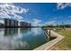Waterfront view of the community with condo buildings in the background and dock at 12651 Garibaldi Ln, Venice, FL 34293