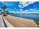 Relaxing waterfront boardwalk with scenic lake views and comfortable seating at 12651 Garibaldi Ln, Venice, FL 34293