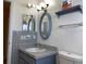 Simple bathroom with a vanity and oval mirror at 13457 Muriel Ave, Port Charlotte, FL 33981