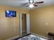 Cozy bedroom featuring a closet and TV at 13457 Muriel Ave, Port Charlotte, FL 33981
