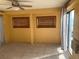 Bedroom with sliding glass doors and window at 13457 Muriel Ave, Port Charlotte, FL 33981
