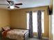 Small bedroom with twin bed and ceiling fan at 13457 Muriel Ave, Port Charlotte, FL 33981