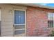 Front entry with blue door and brick facade at 13457 Muriel Ave, Port Charlotte, FL 33981