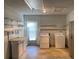 Laundry room with washer, dryer, and shelving at 13457 Muriel Ave, Port Charlotte, FL 33981