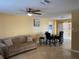 Spacious living room with dining area and ample natural light at 13457 Muriel Ave, Port Charlotte, FL 33981