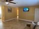 Living room with sofa and mounted TV at 13457 Muriel Ave, Port Charlotte, FL 33981