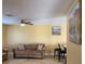 Living room features a sofa and access to dining area at 13457 Muriel Ave, Port Charlotte, FL 33981