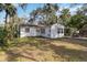 Home's backyard with large lot and mature trees at 1376 18Th St, Sarasota, FL 34234