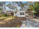 Home's backyard with large lot and mature trees at 1376 18Th St, Sarasota, FL 34234