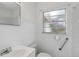 Clean bathroom with shower, toilet, and grab bar at 1376 18Th St, Sarasota, FL 34234