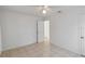 Simple bedroom with tiled floors and access to another room at 1376 18Th St, Sarasota, FL 34234
