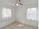 Well-lit bedroom featuring tiled floors and two windows at 1376 18Th St, Sarasota, FL 34234