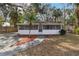 Cute bungalow with screened porch, fenced yard, and spacious driveway at 1376 18Th St, Sarasota, FL 34234