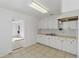 Efficient kitchen with white cabinets and tiled floors at 1376 18Th St, Sarasota, FL 34234