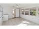 Sunlit laundry room with tile floors and backyard access at 1376 18Th St, Sarasota, FL 34234