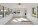 Laundry area with tile floor,ceiling fan and access to backyard at 1376 18Th St, Sarasota, FL 34234