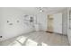 Laundry room with tile floor, exterior access, and nearby kitchen at 1376 18Th St, Sarasota, FL 34234