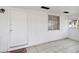Screened porch features tiled floors and a white door at 1376 18Th St, Sarasota, FL 34234