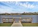 Serene fishing dock overlooking a lake at 15859 Islandwalk Ave, Bradenton, FL 34211