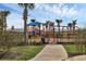 playground with swings and play structures at 15859 Islandwalk Ave, Bradenton, FL 34211